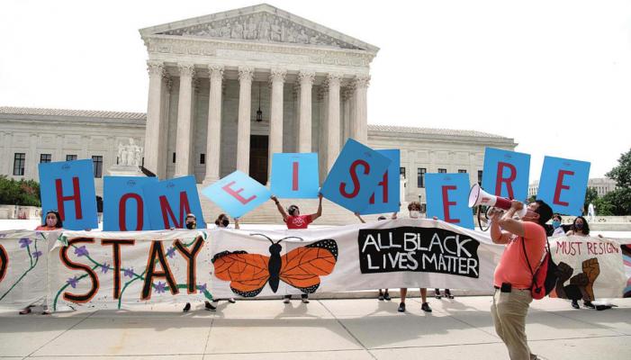 Activists hold a banner in front of the US Supreme Court in Washington, DC, on June 18, 2020. The US Supreme Court rejected President Donald Trump’s move to rescind the DACA program that offers protections to 700,000 undocumented migrants brought to the US as children. (Nicholas Kamm/AFP via Getty Images)