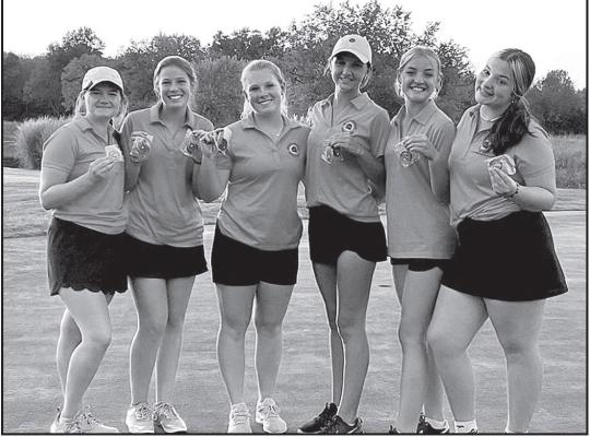 GOLDEN GALS — Lady Bulldogs golf team members (I to r) Hadley Hines, Violet Robins, Lucy Tobins, Mattily Brumley, Anastin Journot and Sadeee McCollam show off their hardware following a first place finish at Pittsburg on Tuesday, September 27. | Courtesy Photo