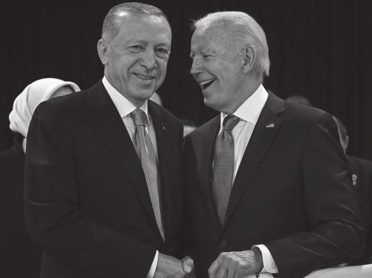 Turkey’s President Recep Tayyip Erdogan (left) and US President Joe Biden shake hands at the start of the first plenary session of the NATO summit at the Ifema congress centre in Madrid, on June 29, 2022. (Gabriel Bouys/AFP via Getty Images/TNS)