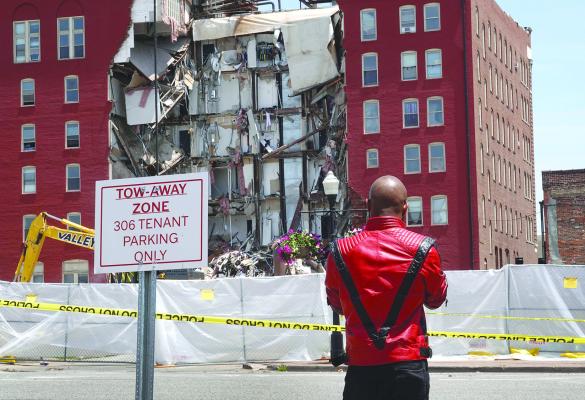 People view a six-story apartment building after it collapsed on May 29, 2023, in Davenport, Iowa. (Scott Olson/Getty Images/TNS)