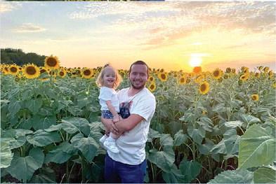 Linda Green sent in this sweet picture of Jacob and Naomi posed in front of a field of beautiful sunflowers and a gorgeous Kansas sunset.