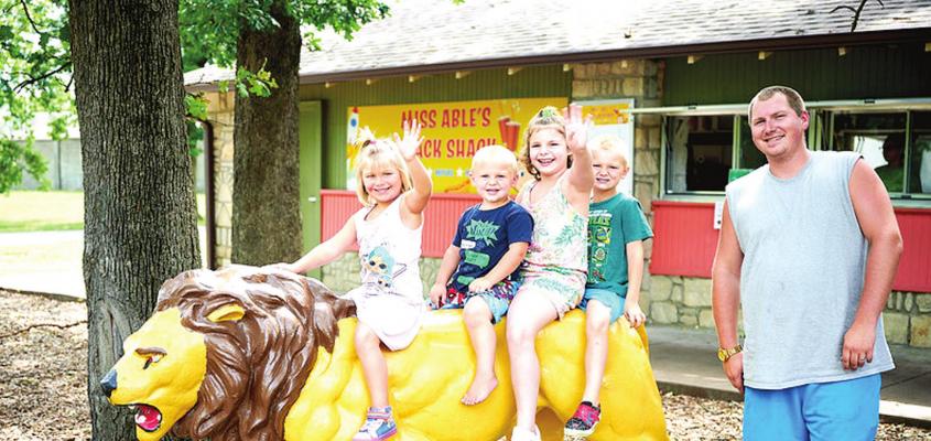 NO LION, THE PARK IS FUN — A young family enjoys playing at Miss Able's Snack Shack, located in Ralph Mitchell Zoo. Pictured, left to right, Hope, Rylyn, Annah, Jonny and Jake Sweat. Joshua Meadows | Courtesy Photo