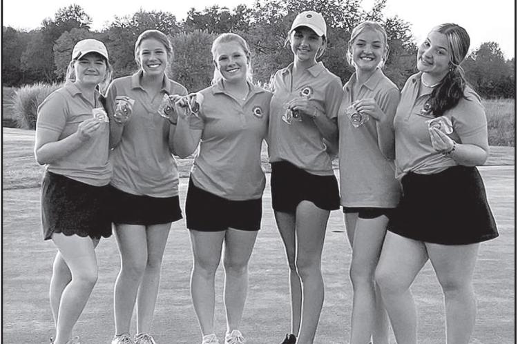 GOLDEN GALS — Lady Bulldogs golf team members (I to r) Hadley Hines, Violet Robins, Lucy Tobins, Mattily Brumley, Anastin Journot and Sadeee McCollam show off their hardware following a first place finish at Pittsburg on Tuesday, September 27. | Courtesy Photo