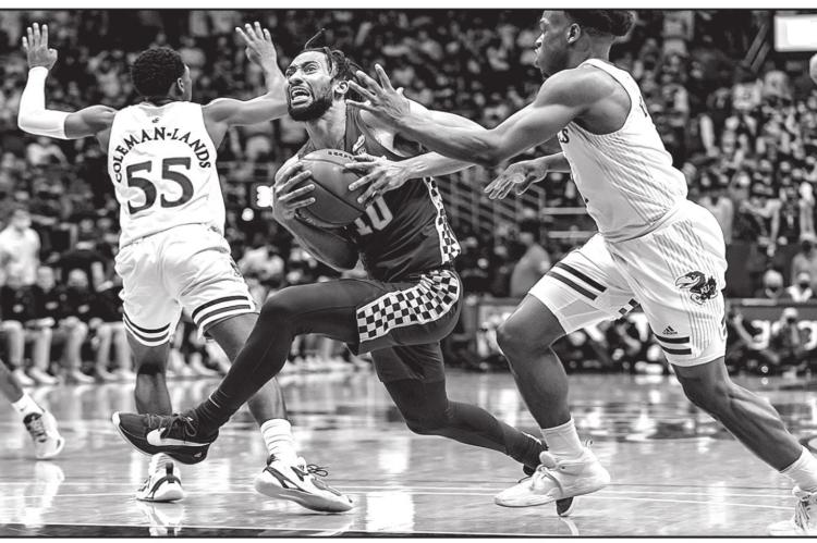 Kentucky's Davion Mintz (1 O) draws a foul against Kansas' Joseph Yesufu, right, in the second half at Allen Fieldhouse on Saturday, Jan. 29, 2022, in Lawrence, Kansas. Kyle Rivas I Getty Images I TNS