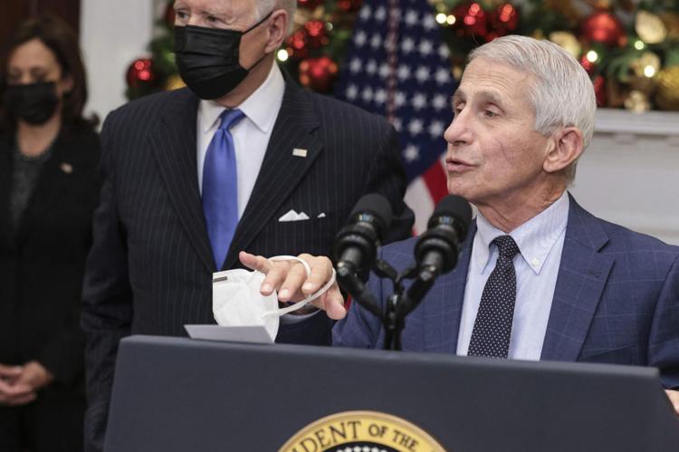 Dr. Anthony Fauci, chief medical adviser to the president, right, joined by U.S. President Joe Biden, center, and Vice President Kamala Harris, left, speaks on the omicron variant in the Roosevelt Room of the White House in-Washington, D.C., U.S., on Monday, Nov. 29, 2021. (Oliver Contreras/Pool/ABACAPRESS.COM/TNS)