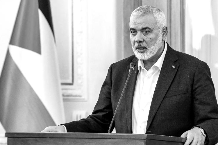 Ismail Haniyeh, the Doha-based political bureau chief of the Palestinian Islamist movement Hamas, speaks to the press after a meeting with the Iranian foreign minister in Tehran on March 26, 2024. Haniyeh's visit to Tehran comes a day after a resolution adopted by the UN Security Council called for an 'immediate ceasefire' for the ongoing Muslim holy month of Ramadan, leading to a 'lasting' truce. (-/AFP via Getty Images/TNS)