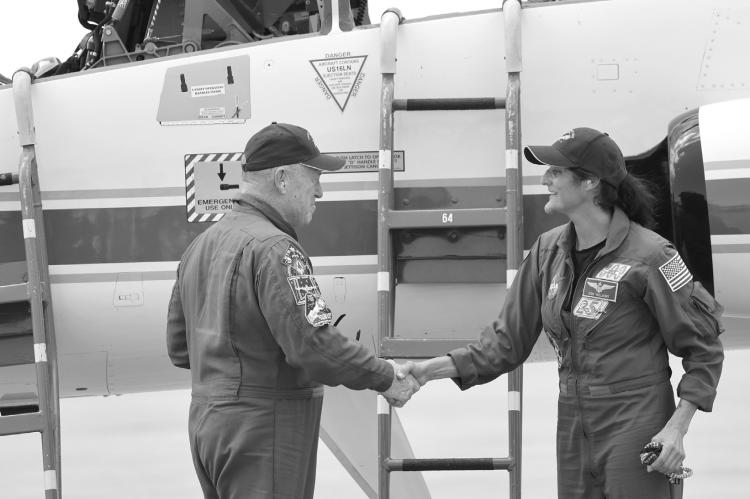 From left, NASA astronauts Butch Wilmore and Suni Williams shake hands after arriving at Kennedy Space Center aboard T-38 jets for the Starliner Crew Flight Test, on Thursday, April 25, 2024. (Ricardo Ramirez Buxeda/ Orlando Sentinel/TNS)