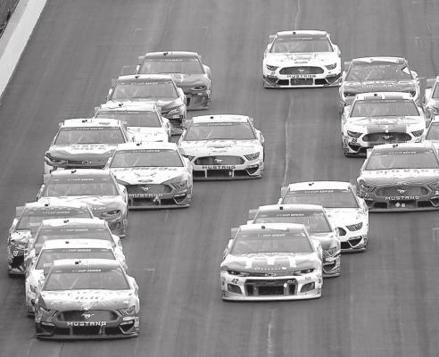 Kevin Harvick leads the field on the final restart of the NASCAR Cup Series Big Machine Hand Sanitizer 400 Powered by Big Machine Records at Indianapolis Motor Speedway on July 5, 2020, in Indianapolis. Jamie Squire | Getty Images | TNS
