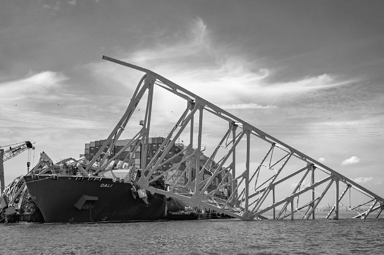 Salvage efforts continue as workers make preparations to remove the wreckage of the Francis Scott Key Bridge from the container ship Dali five weeks after the catastrophic collapse. (Jerry Jackson/The Baltimore Sun/TNS)
